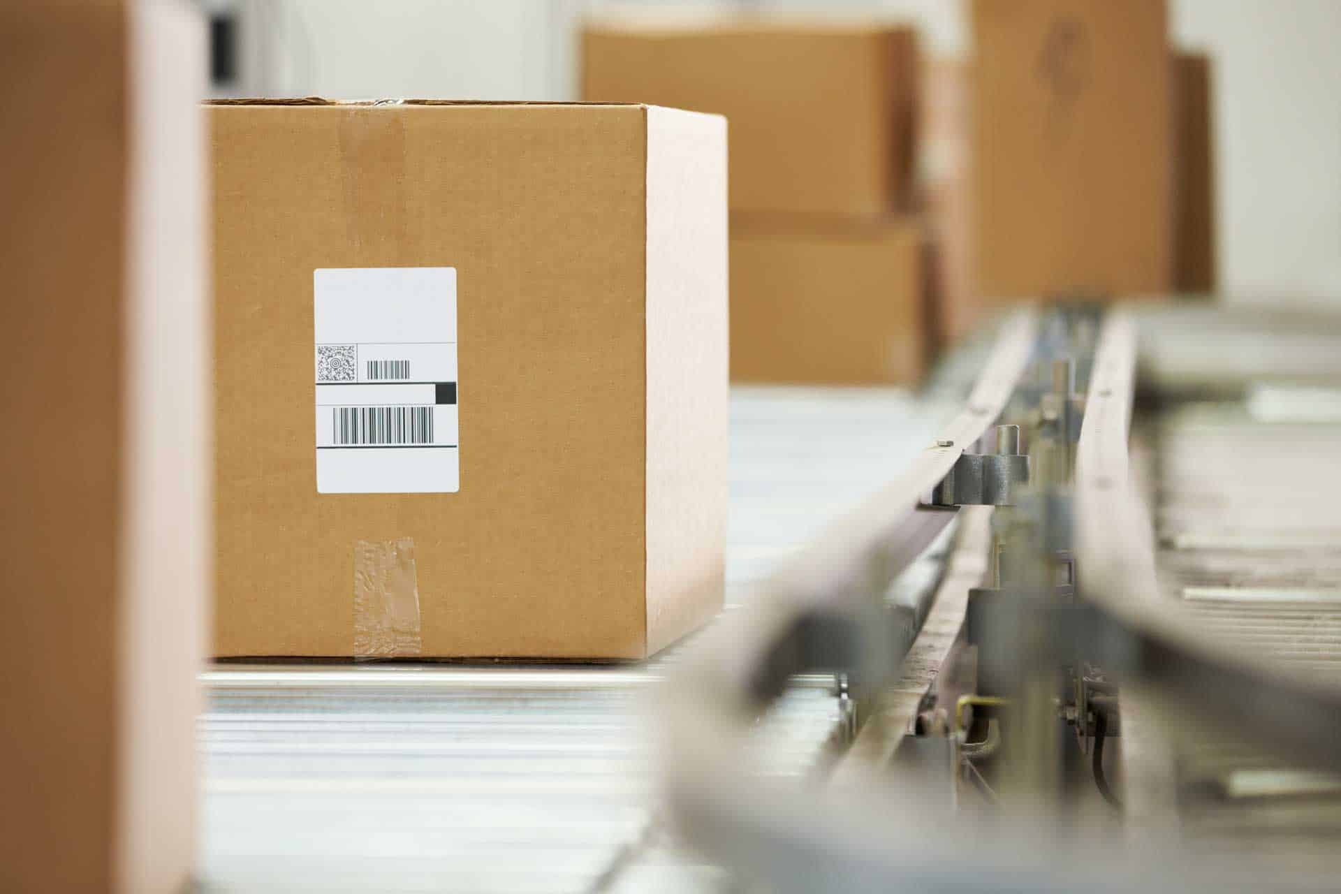 goods on conveyor belt going for scan in distribution warehouse