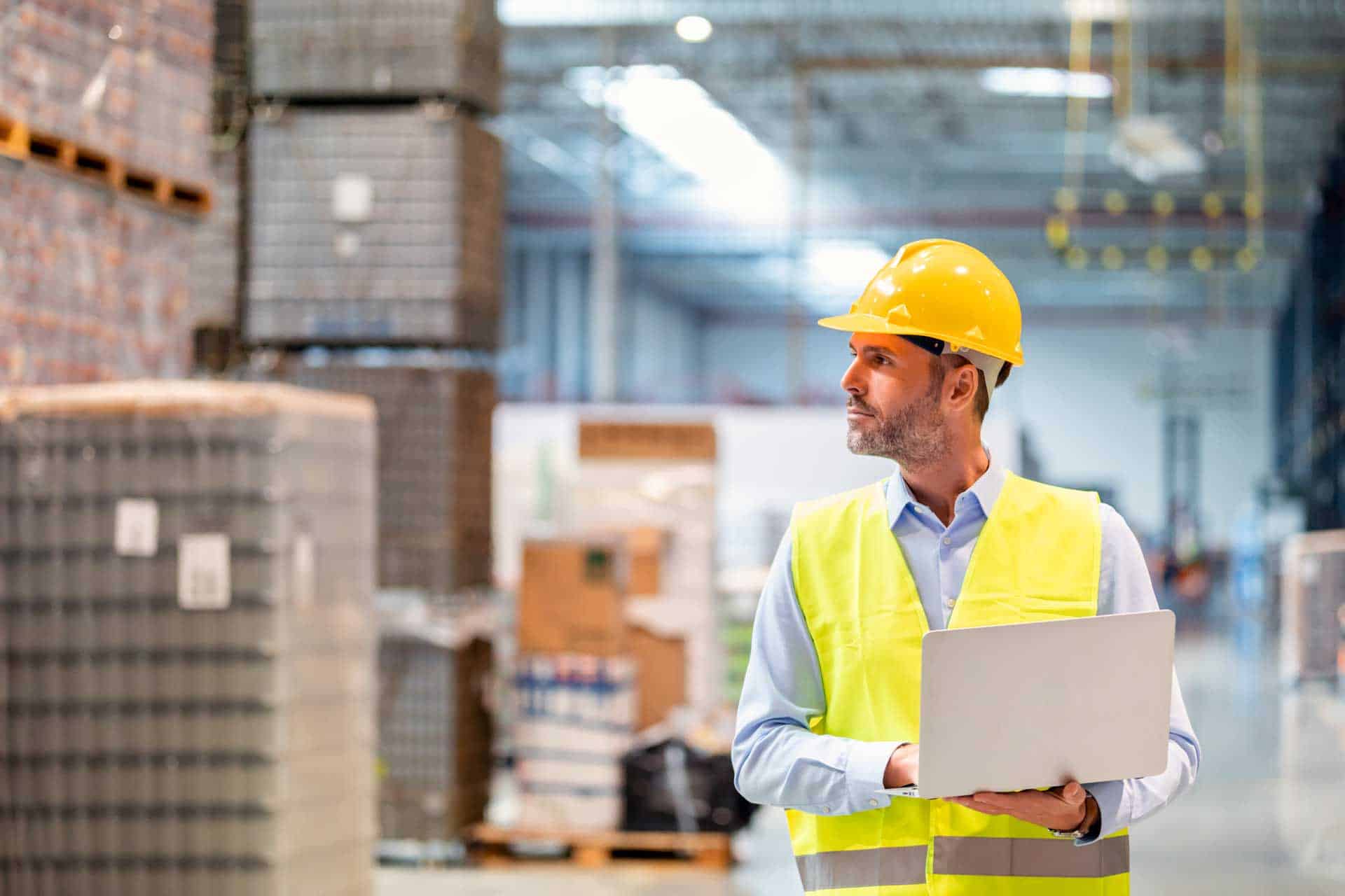 Pallet Dimensioners, Ti Hi Pallet Configuration, and WMS Integration: New Keys to 3PL Warehouse Efficiency 4 warehouse manager with laptop entering inventory
