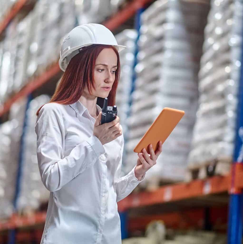 woman looking into tablet talking information